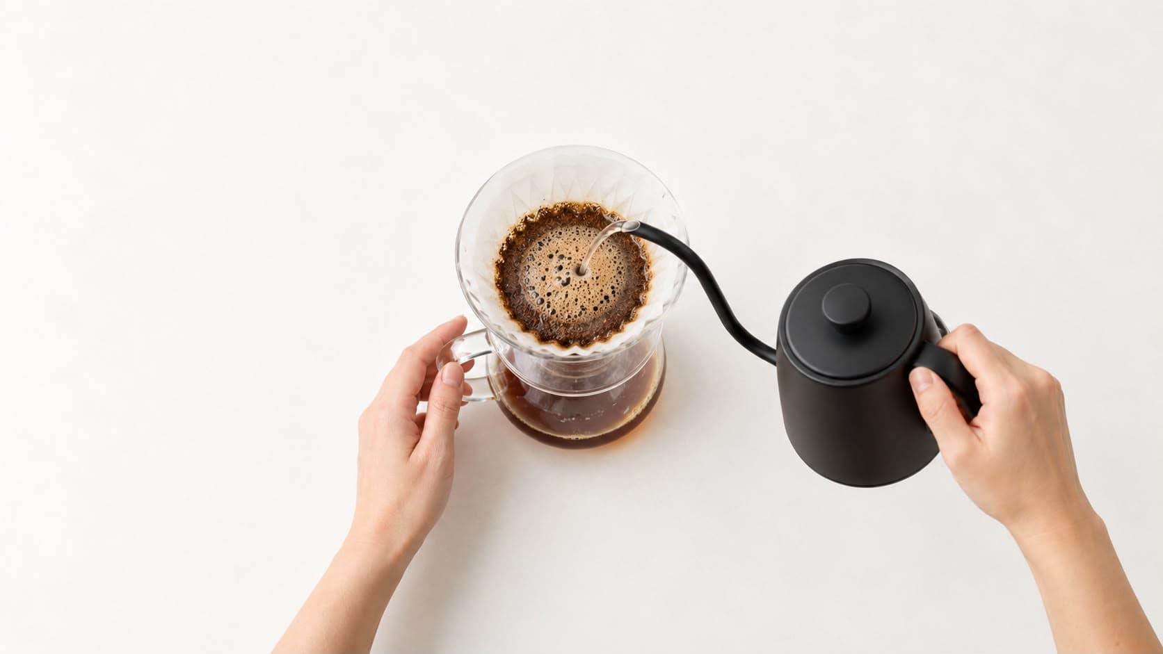 Pour over being brewed with a black gooseneck kettle